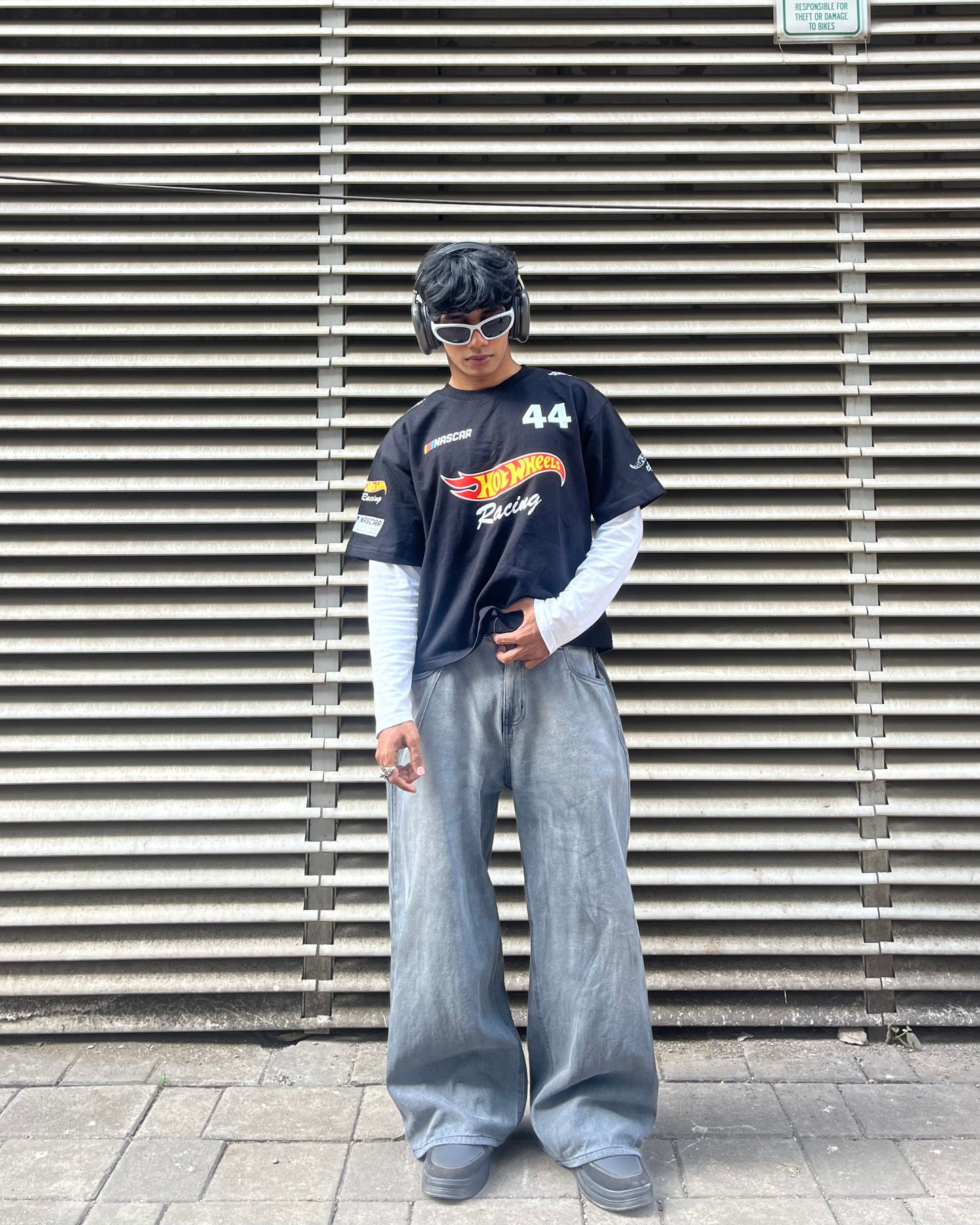 model wearing hot wheels inspired black F1 racing t shirt motorsport streetwear outfit