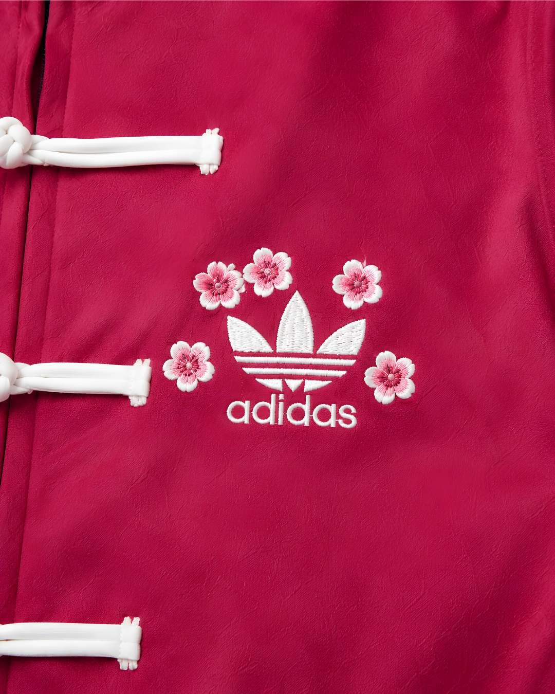 Sakura-Inspired Pink Velvet Chinese Collar Track Cny Jacket with Floral Embroidery.