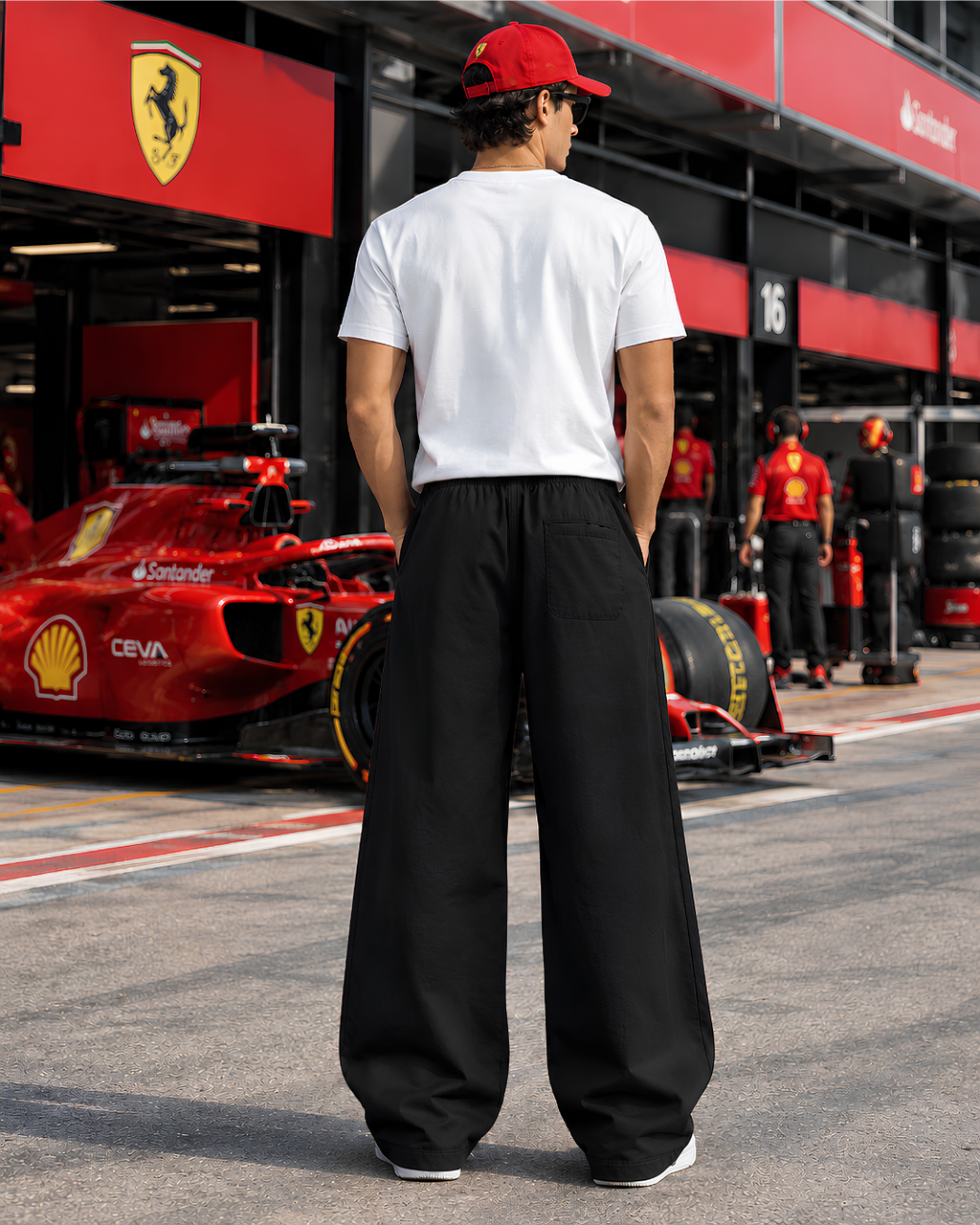 Baggy black racing pants with graphic detailing