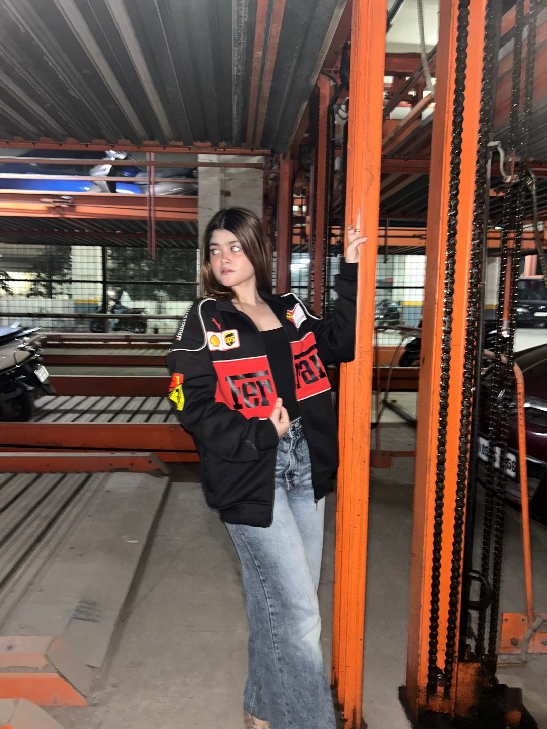 Person wearing a black hoodie with red