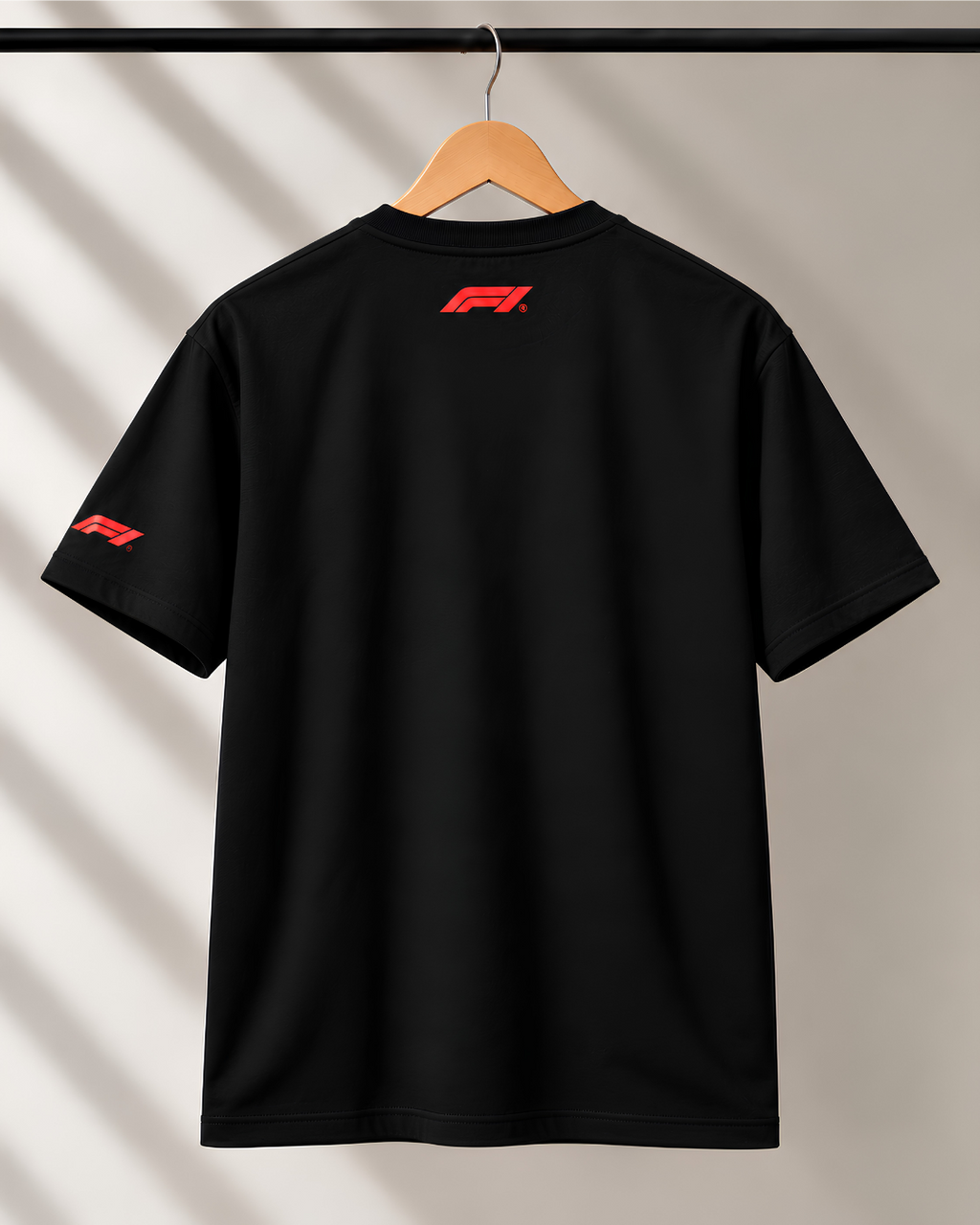 Black motorsport T-shirt back view featuring small red F1 logo below neckline.