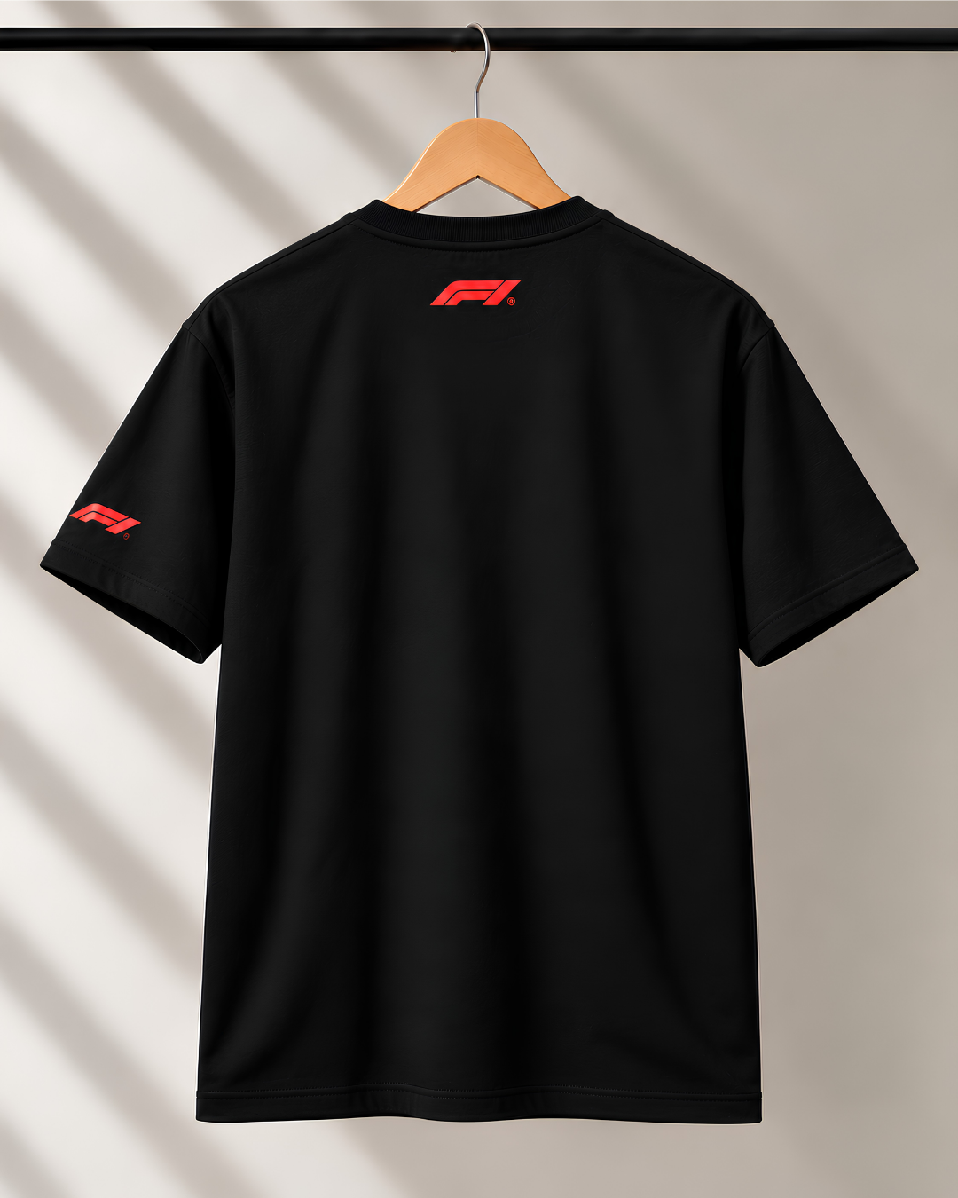 Black motorsport T-shirt back view featuring small red F1 logo below neckline.