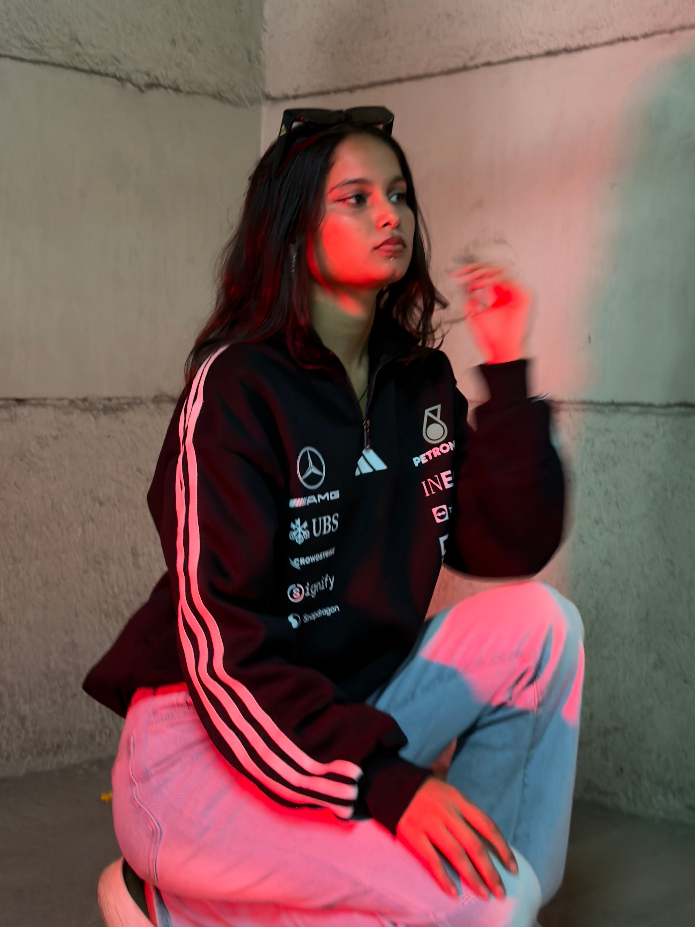 Close up of Petronas inspired black half zip sweatshirt zipper and premium fabric texture detail
