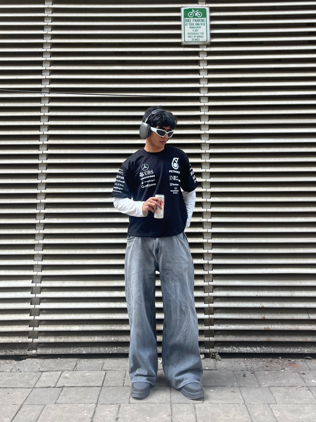 model wearing Petronas inspired black F1 racing t shirt motorsport streetwear outfit