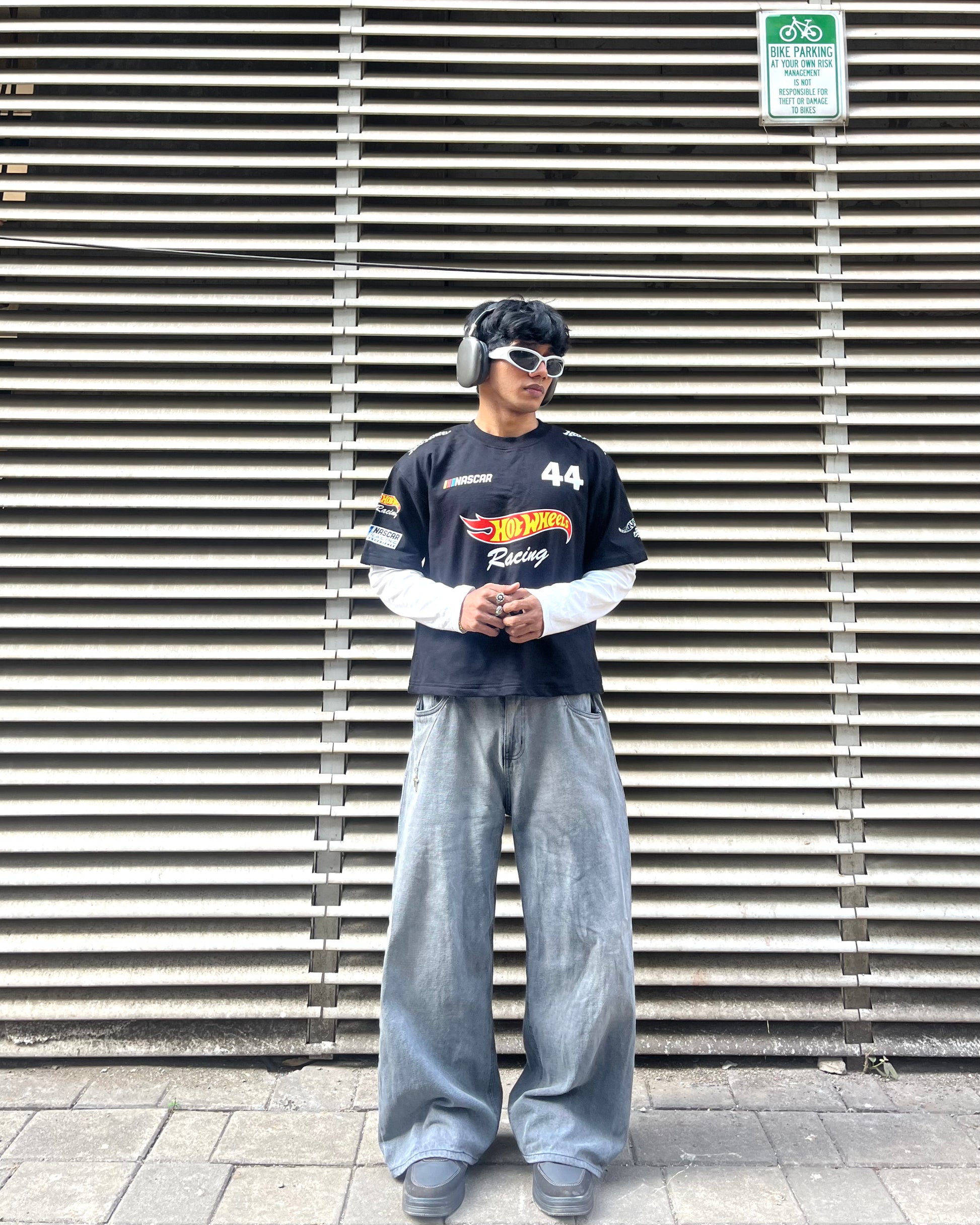 close up of hot wheels inspired racing graphic print on black motorsport t shirt