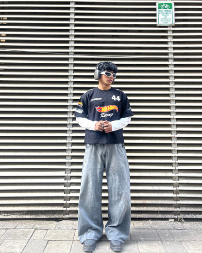 close up of hot wheels inspired racing graphic print on black motorsport t shirt