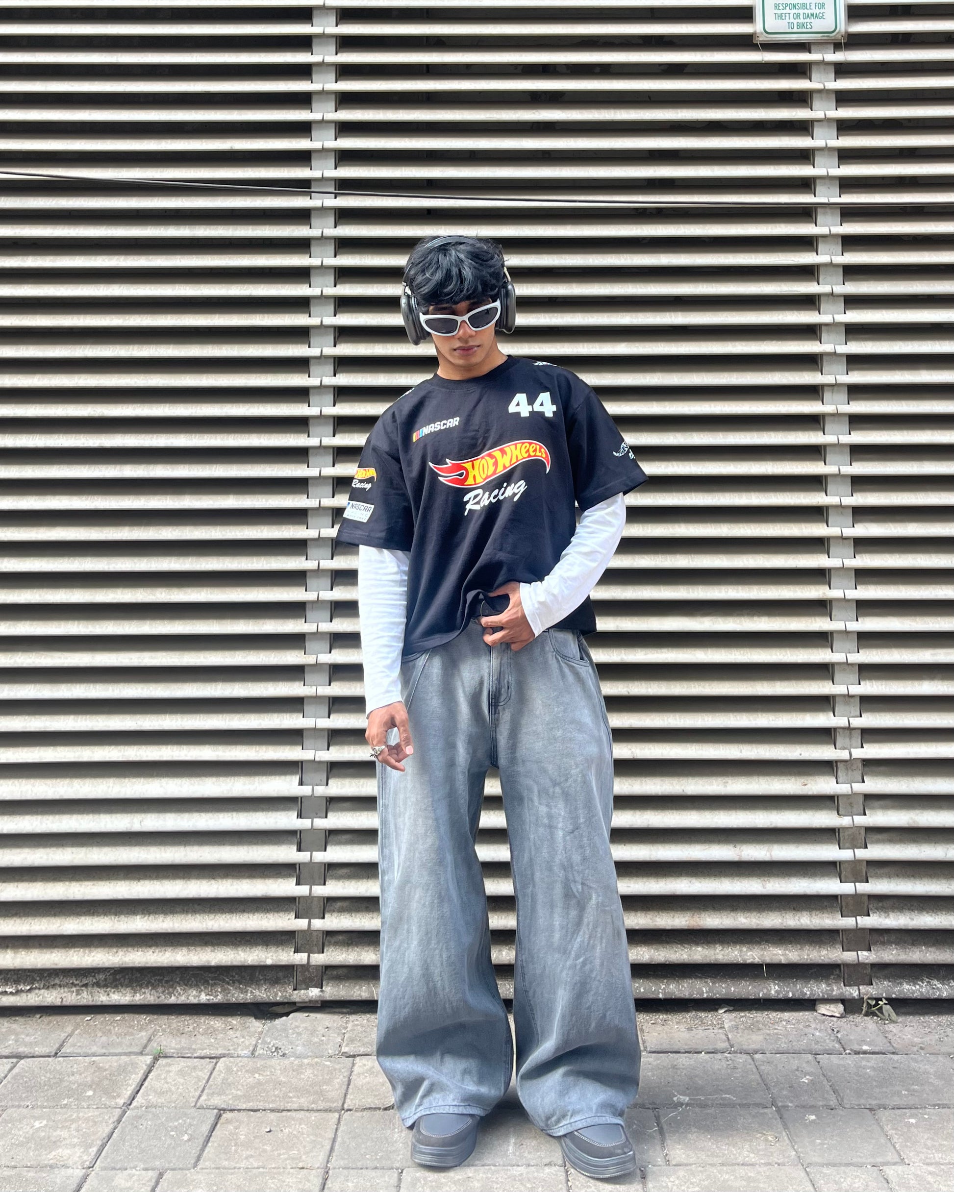 model wearing hot wheels inspired black F1 racing t shirt motorsport streetwear outfit