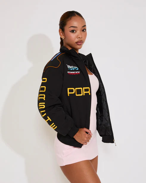 Black parachute puffer jacket inspired by Porsche racing aesthetic, warm sporty streetwear design